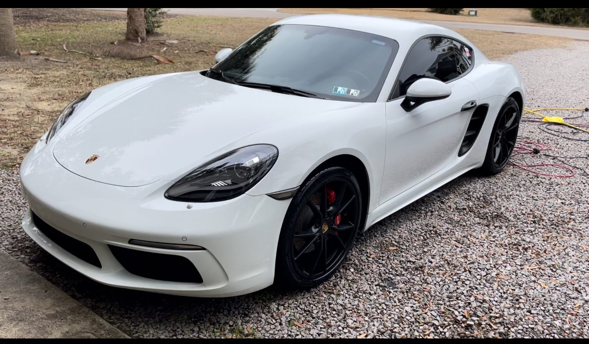 White Porsche Cayman detailed in a Southport NC driveway